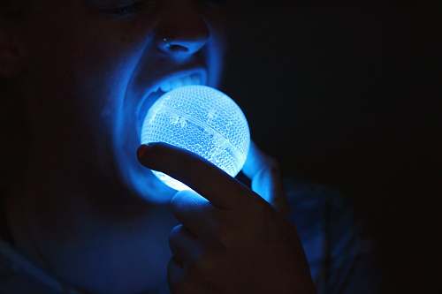 ogden person about to eat blue LED light ball blue